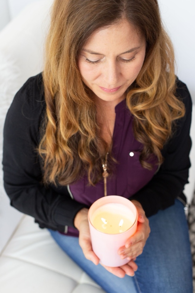 Sienna holding a lit candle