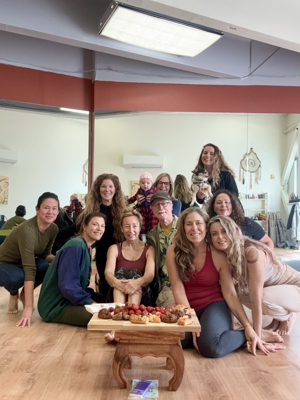 Sienna smiling with a group of students and friends